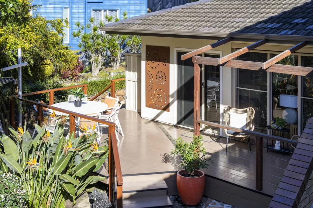 Zen garden entry with steps and Buddha statue in Granny Flat Coal Point Project by Extrabuild