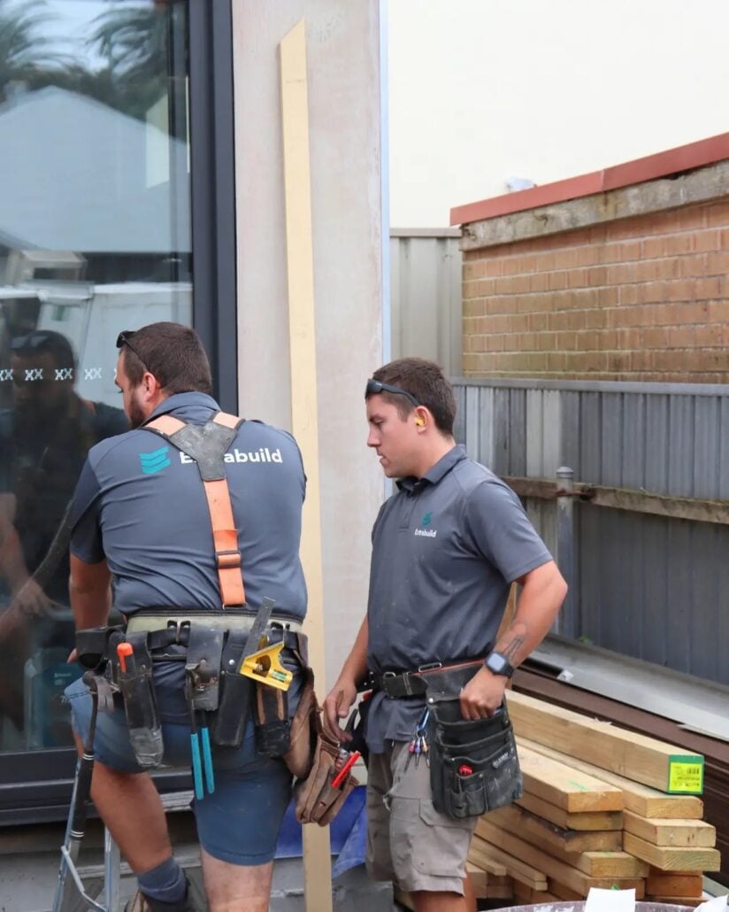 Two construction workers wearing
